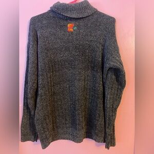 Super Soft Distressed Turtle Neck Sweater with Colorful Repairs.